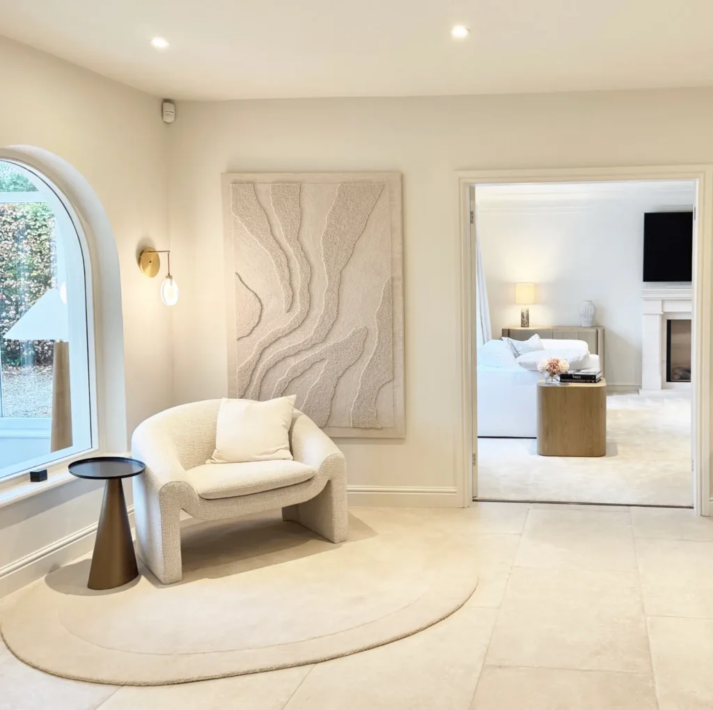 Stone floor, feature tapestry and armchair.