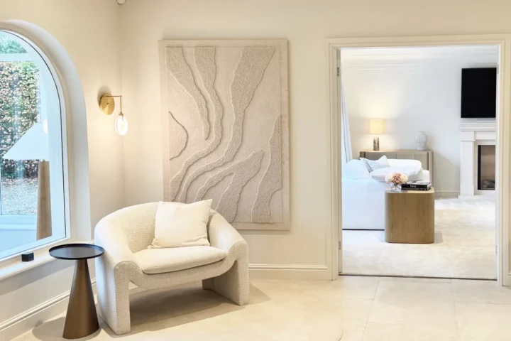 Stone floor, feature tapestry and armchair.
